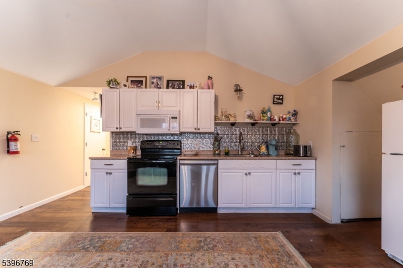 231 Wertsville Road Ringoes, NJ 08551 - Photo 5 of 11 a kitchen with stainless steel appliances granite countertop a stove and cabinets
