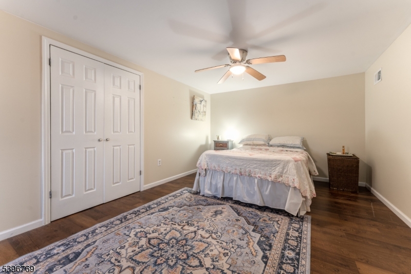231 Wertsville Road Ringoes, NJ 08551 - Photo 8 of 11 a bedroom with a bed and wooden floor
