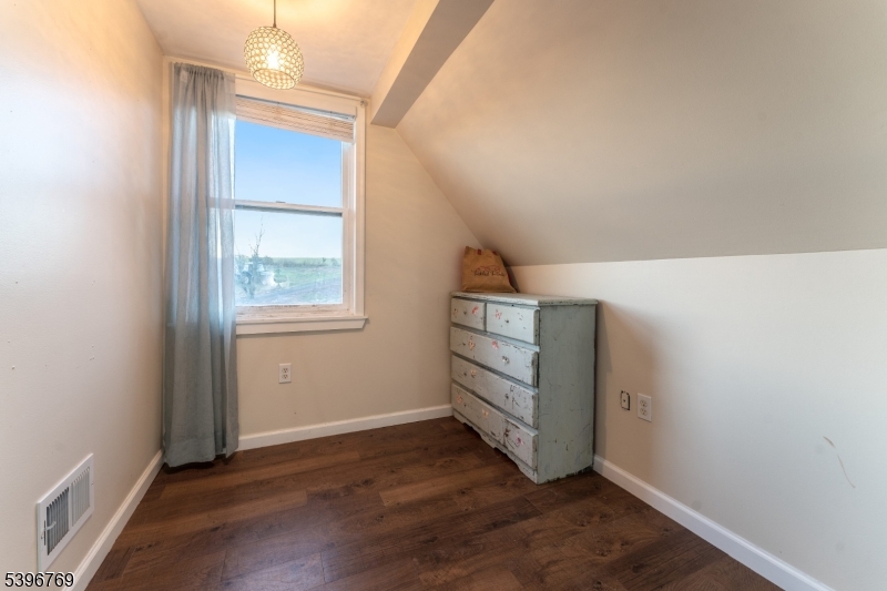 231 Wertsville Road Ringoes, NJ 08551 - Photo 9 of 11 an empty room with wooden floor cabinet and windows