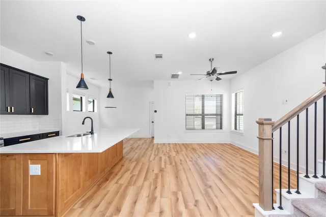 a very nice looking room with a large window and chandelier