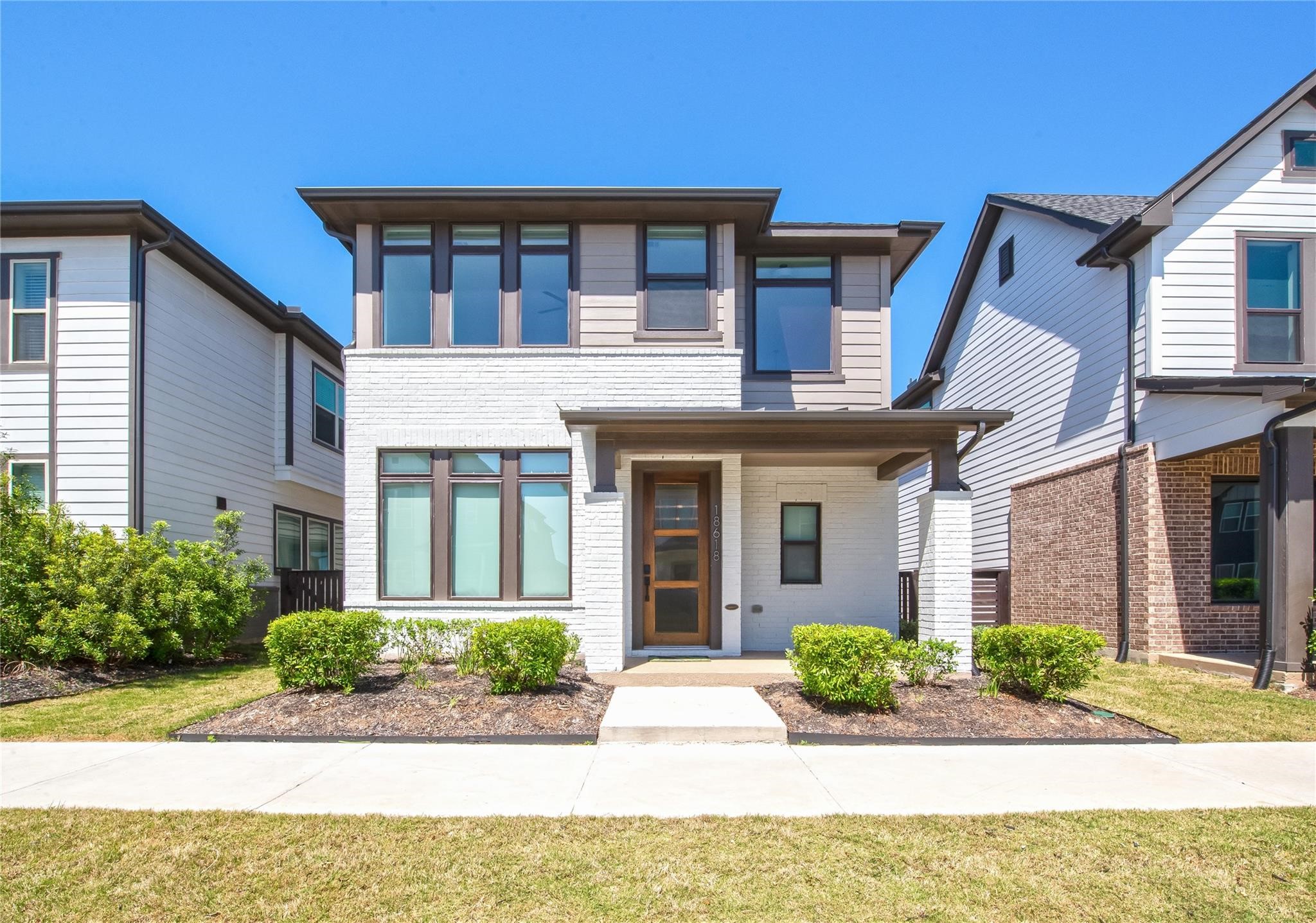 18618 Courteous Way Cypress, TX 77433 - Photo 2 of 30 a front view of a house with garden