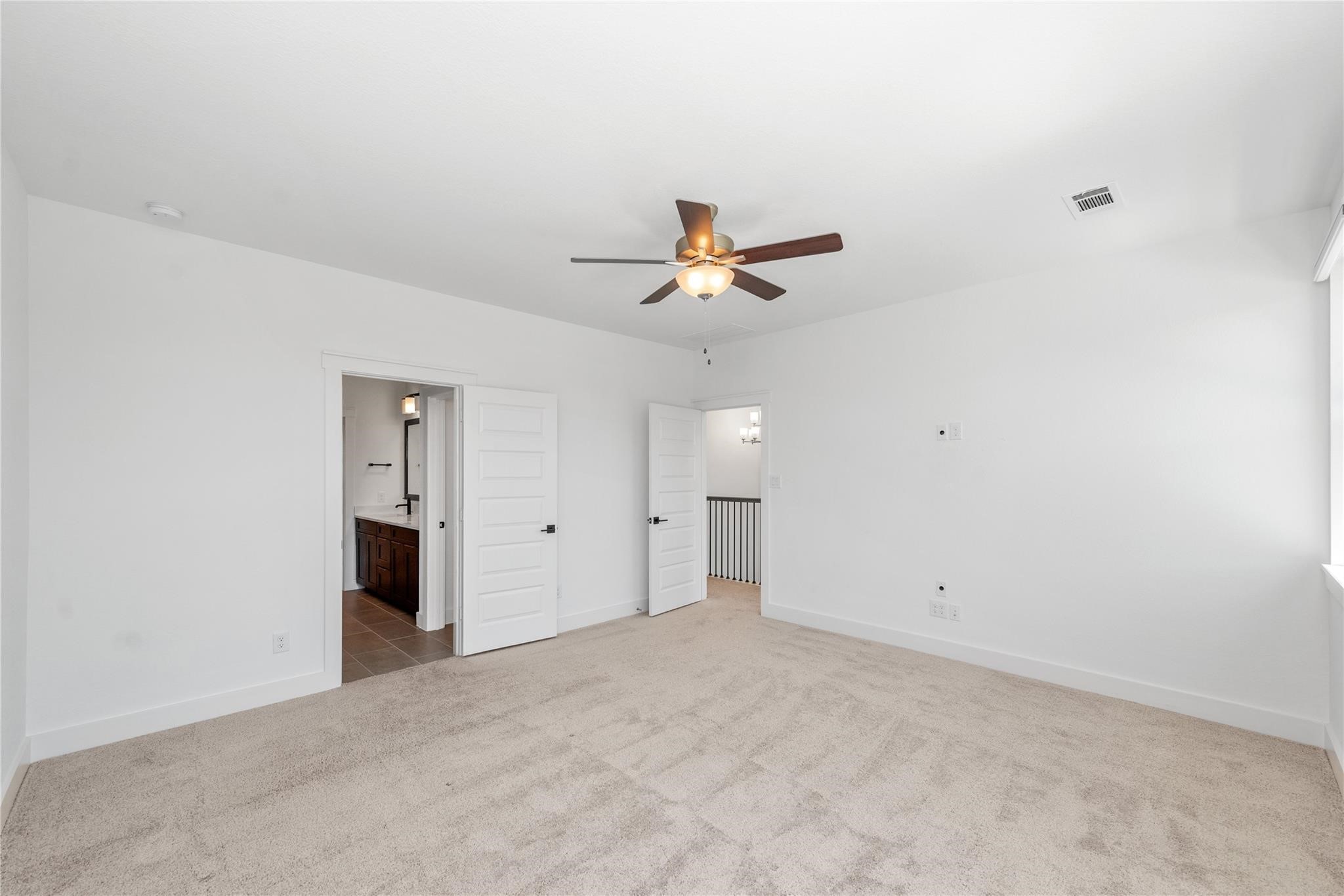 18618 Courteous Way Cypress, TX 77433 - Photo 21 of 30 an empty room with closet and a ceiling fan
