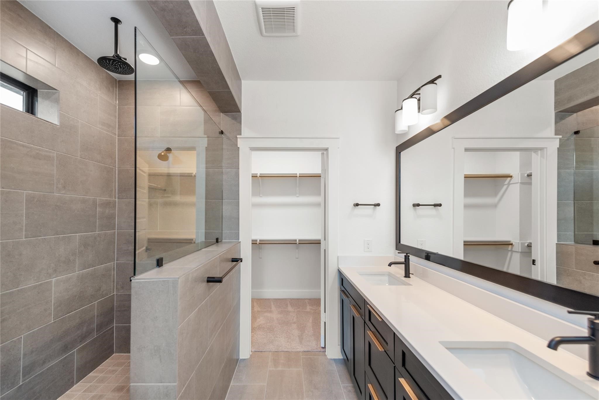 18618 Courteous Way Cypress, TX 77433 - Photo 24 of 30 a bathroom with a double vanity sink mirror and double