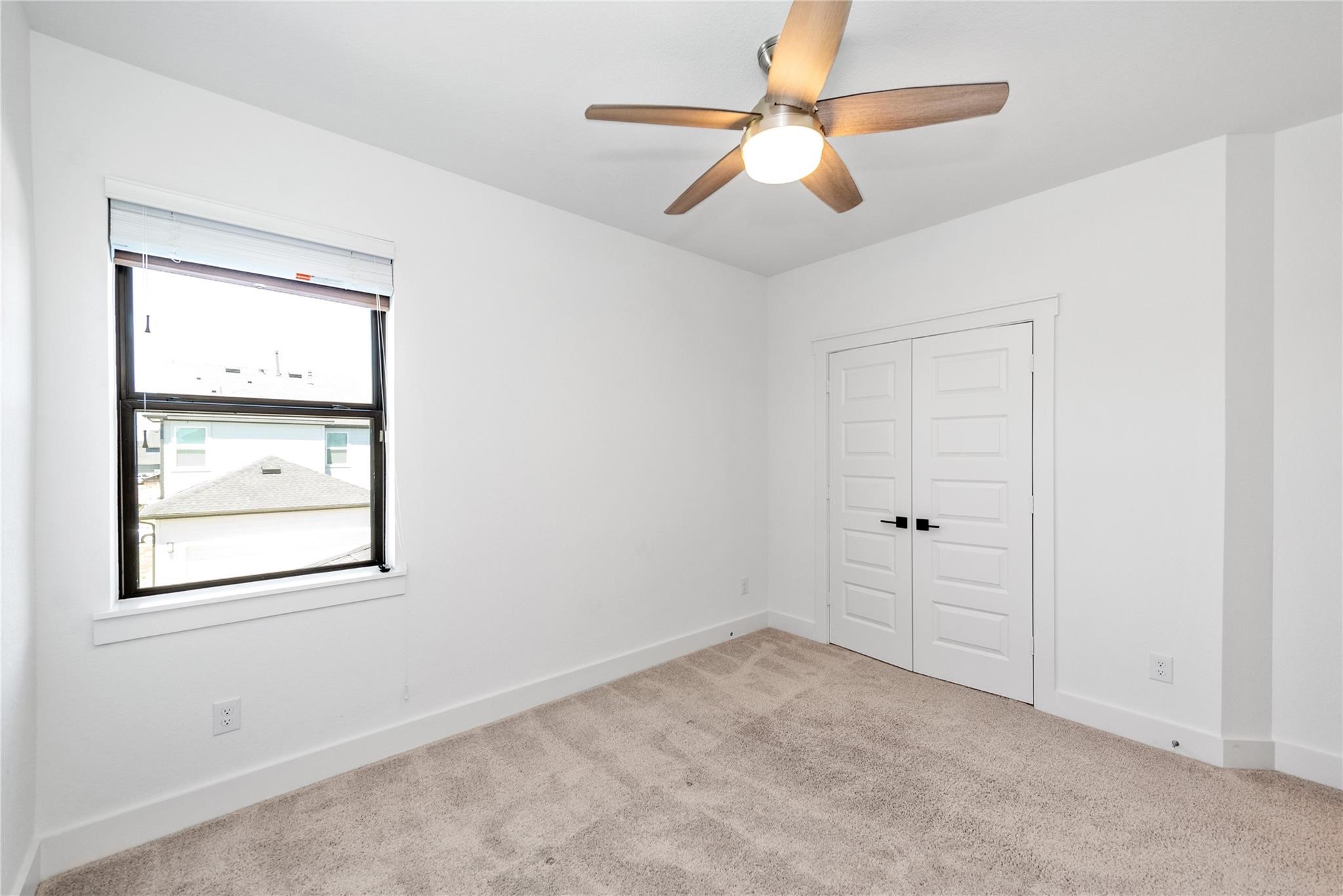 18618 Courteous Way Cypress, TX 77433 - Photo 25 of 30 a view of room with window and ceiling fan