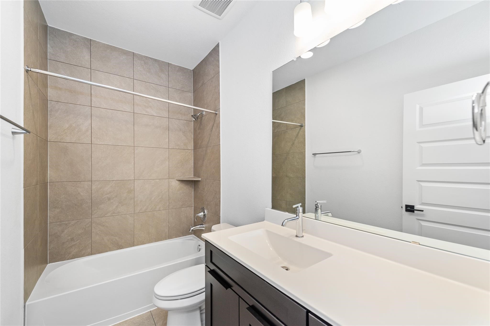 18618 Courteous Way Cypress, TX 77433 - Photo 27 of 30 a bathroom with a sink a toilet and shower