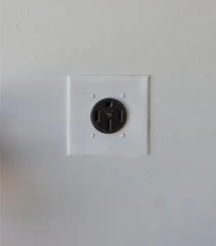 a close view of a utility room with a washer and dryer