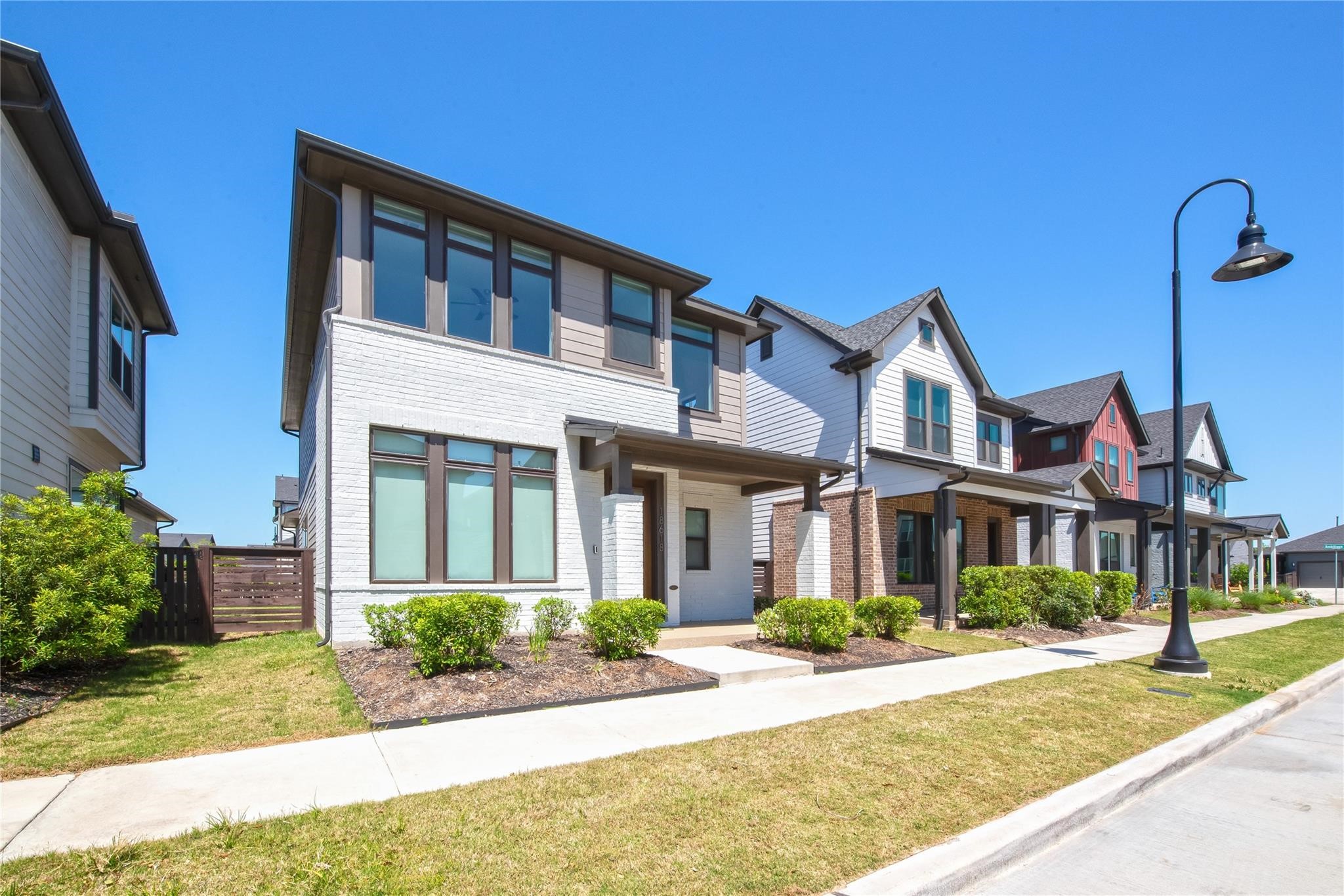 18618 Courteous Way Cypress, TX 77433 - Photo 3 of 30 a front view of a house with garden