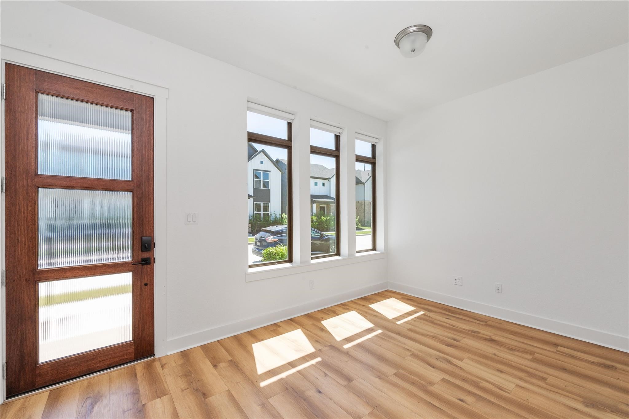 18618 Courteous Way Cypress, TX 77433 - Photo 4 of 30 a view of empty room with wooden floor and fan