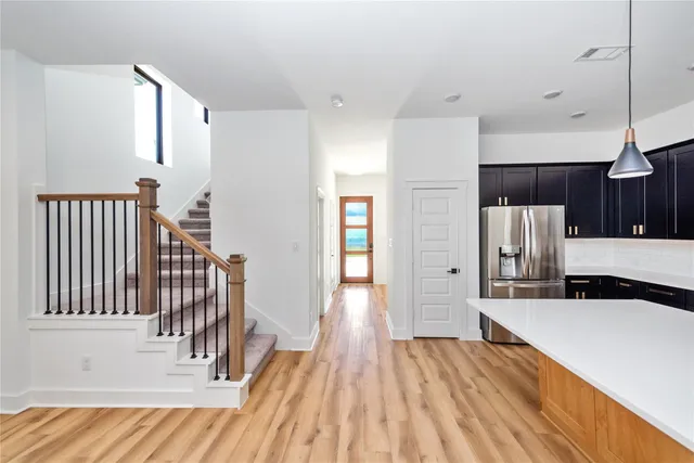 a view of a kitchen from the hallway