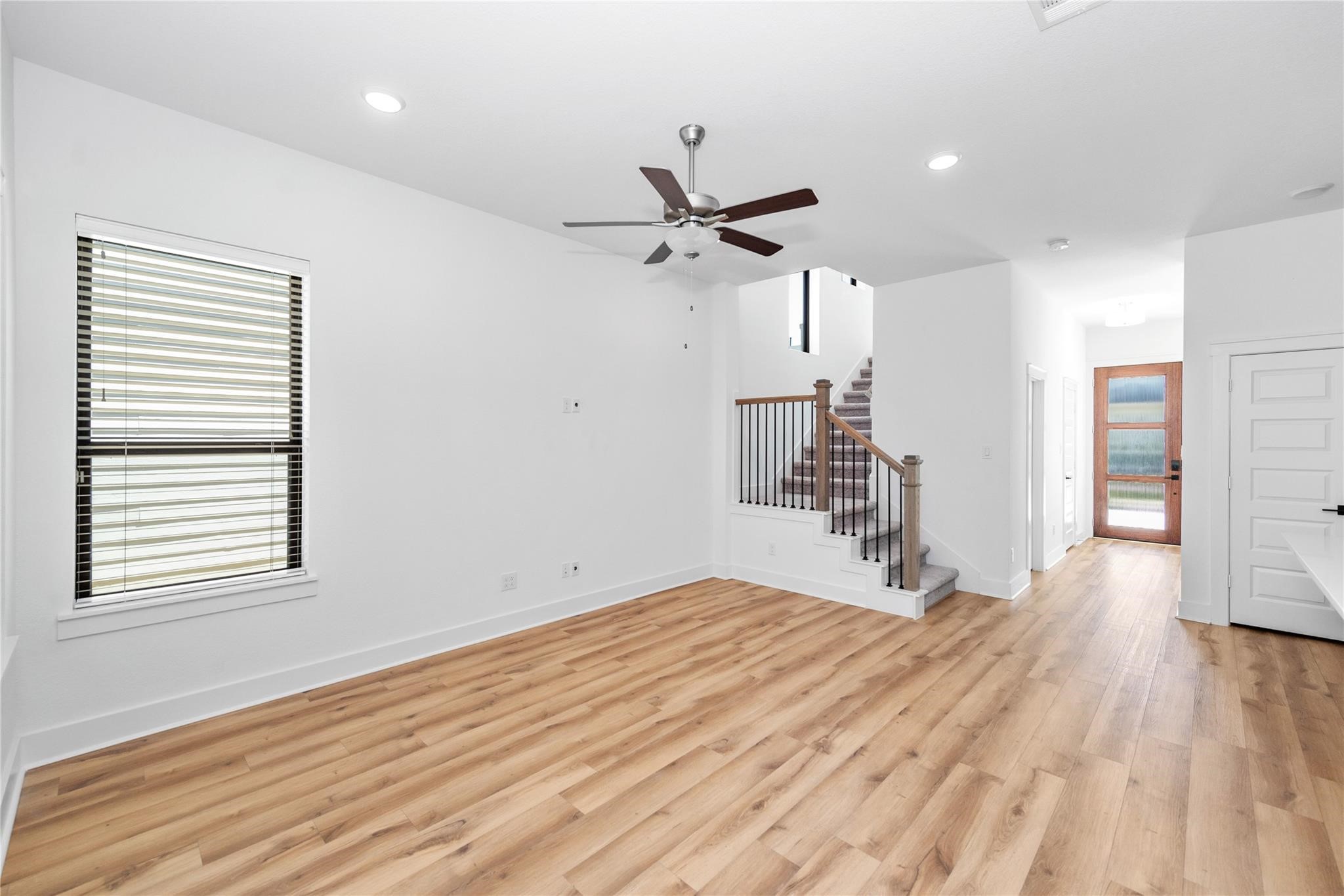 18618 Courteous Way Cypress, TX 77433 - Photo 8 of 30 a view of empty room with wooden floor and fan