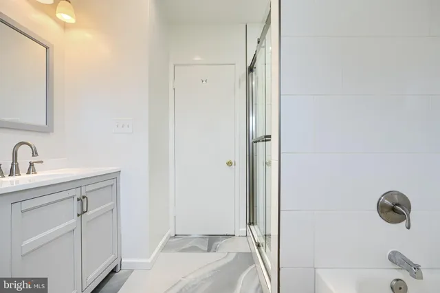 a bathroom with a sink and mirror