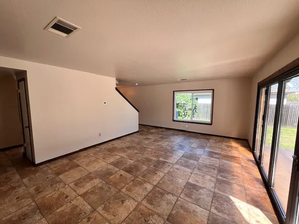 a view of a big room with windows