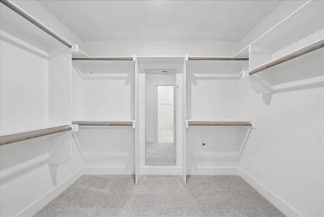 a view of an empty walk in closet