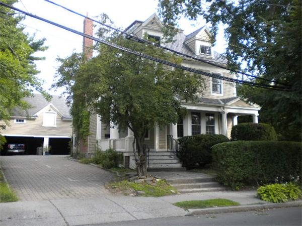 38 Fuller Street Brookline, MA 02446 - Photo 1 of 28 a front view of a house with a yard and potted plants