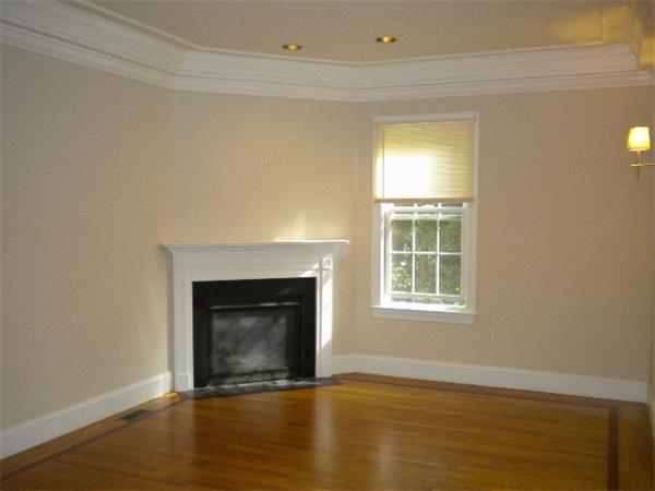 38 Fuller Street Brookline, MA 02446 - Photo 11 of 28 a view of an empty room with wooden floor and a window