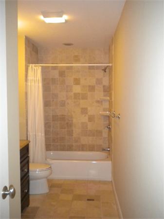 38 Fuller Street Brookline, MA 02446 - Photo 14 of 28 a bathroom with a bathtub and a shower