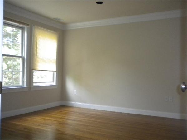 38 Fuller Street Brookline, MA 02446 - Photo 15 of 28 an empty room with wooden floor and windows