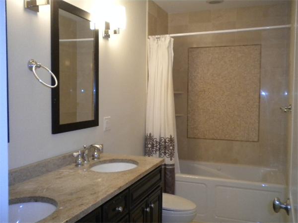 38 Fuller Street Brookline, MA 02446 - Photo 16 of 28 a bathroom with a granite countertop sink toilet and shower