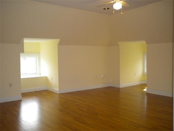 38 Fuller Street Brookline, MA 02446 - Photo 23 of 28 a view of an empty room with wooden floor and a window