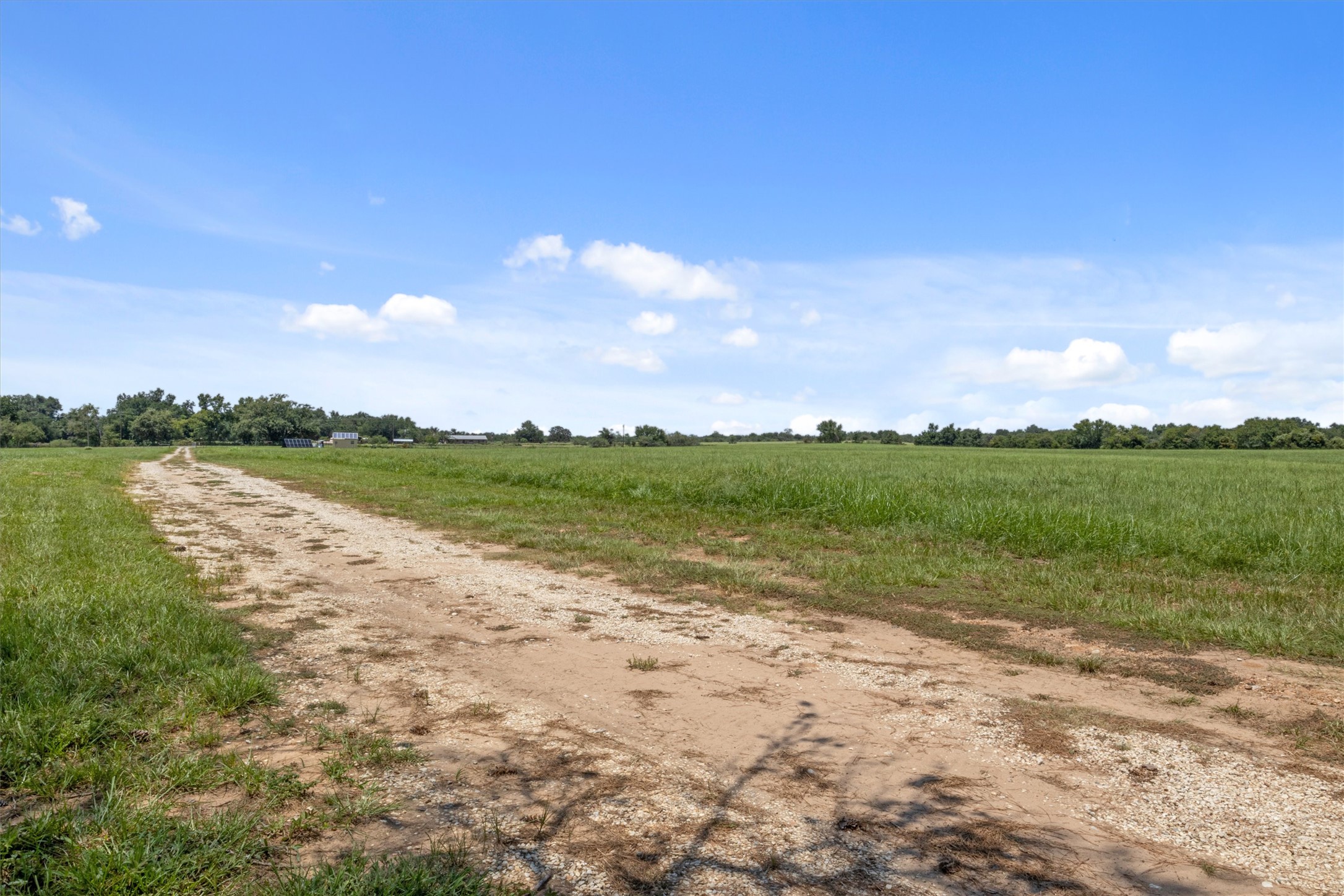 451 Pleasant Grove Road Elgin, TX 78621 - Photo 20 of 26 View of street with a rural view
