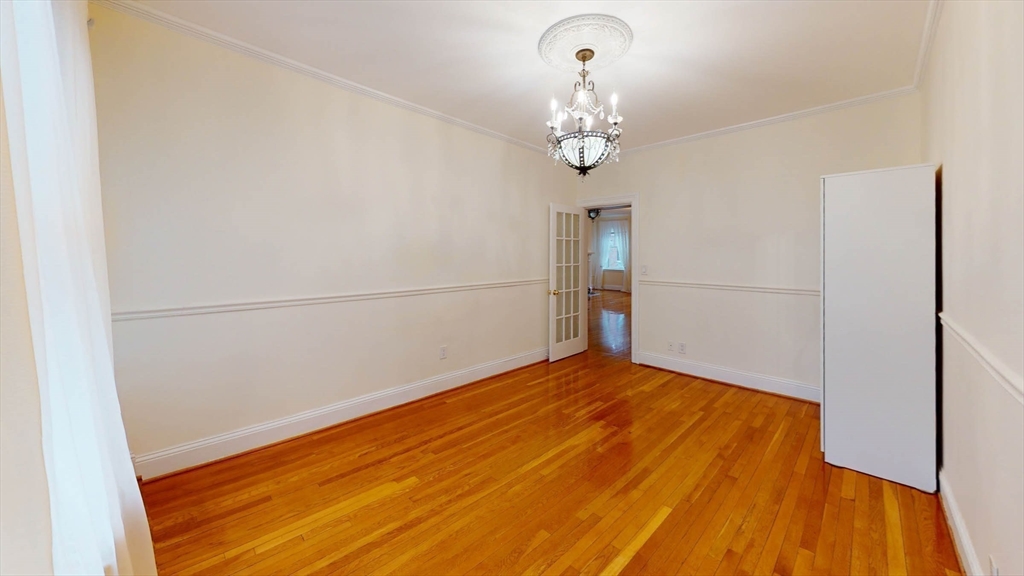 311 Tappan Street, Unit 3 Brookline, MA 02445 - Photo 24 of 35 a view of empty room with wooden floor