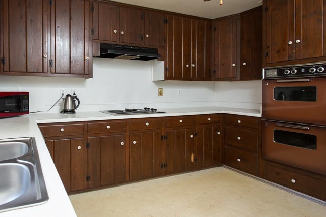 112 Robinhood Road Staunton, VA 24401 - Photo 2 of 18 a kitchen with stainless steel appliances granite countertop a sink a stove and cabinets