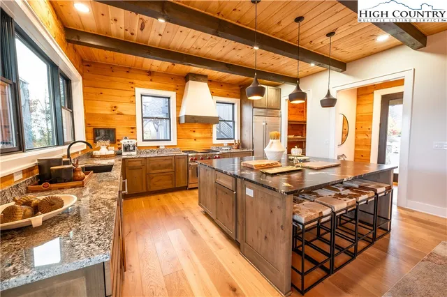 a bed sitting in a bedroom next to a large window