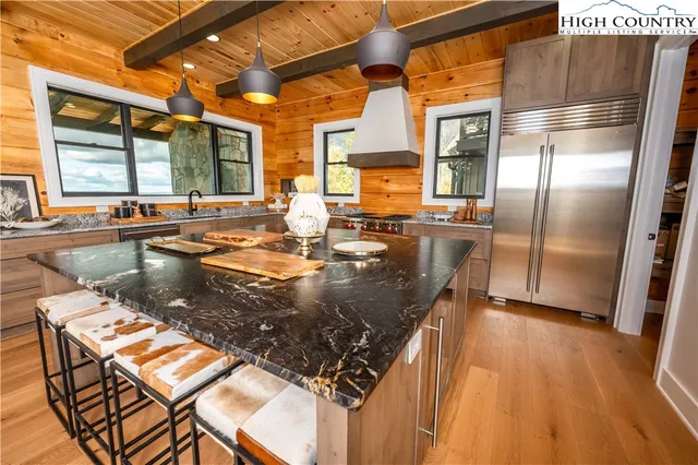 a bed room with a bed and a large mirror