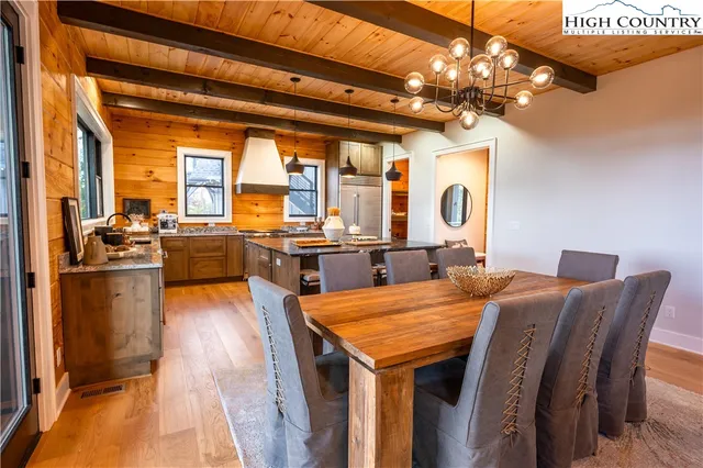 a bedroom with furniture and large windows