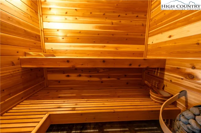 a living room with a large window and a table