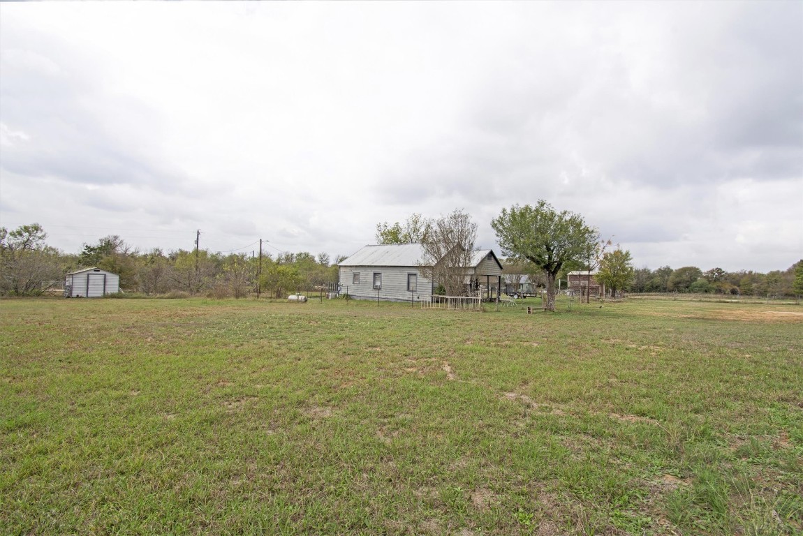 163 Lower Elgin Road Elgin, TX 78621 - Photo 4 of 9 a view of a lake with houses in the back