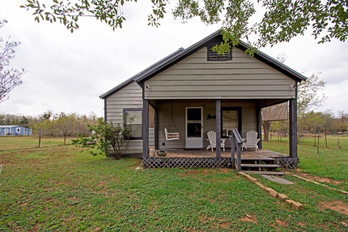 163 Lower Elgin Road Elgin, TX 78621 - Photo 5 of 9 a front view of house with a garden and patio