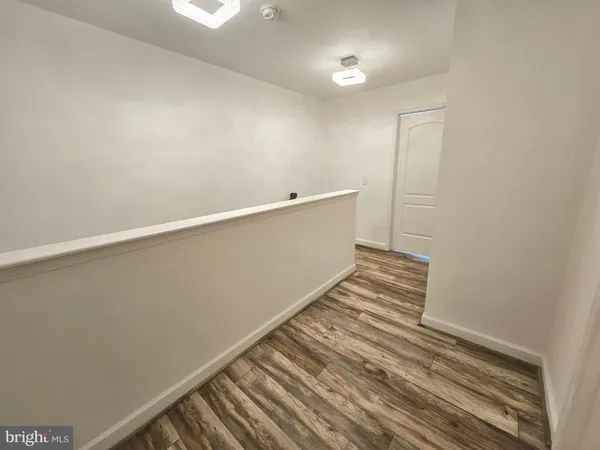 wooden floor and windows in an empty room