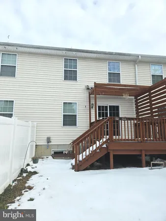 a view of an entryway with a mirror