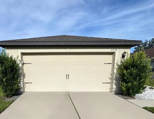 a view of a backyard space with hardwood
