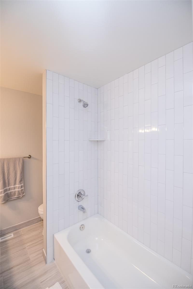 7906 Chase Circle, Unit 143 Arvada, CO 80003 - Photo 21 of 38 a bathroom with a bathtub