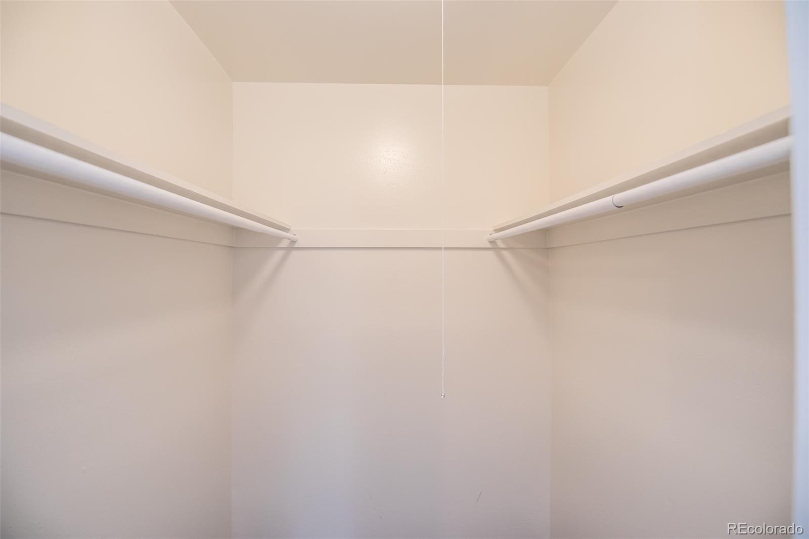 7906 Chase Circle, Unit 143 Arvada, CO 80003 - Photo 26 of 38 a view of a room with racks on the wall