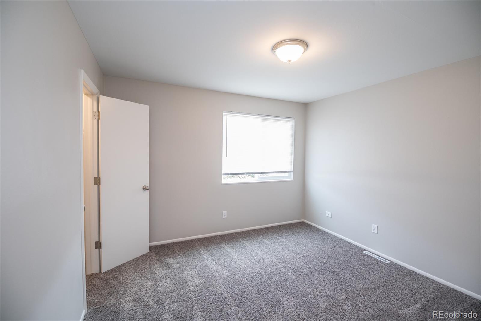 7906 Chase Circle, Unit 143 Arvada, CO 80003 - Photo 29 of 38 a view of an empty room with a window