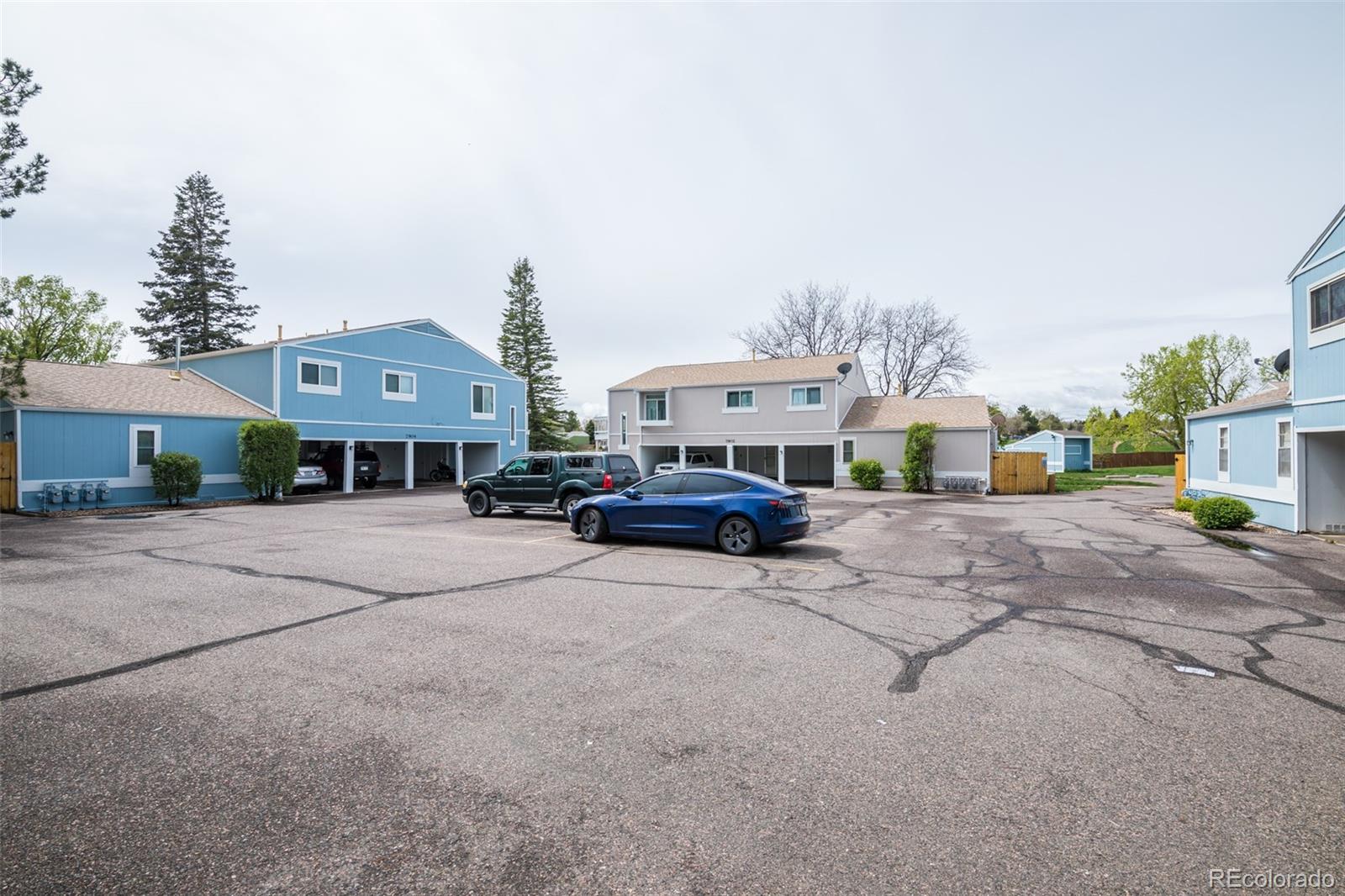 7906 Chase Circle, Unit 143 Arvada, CO 80003 - Photo 30 of 38 a car parked in front of house