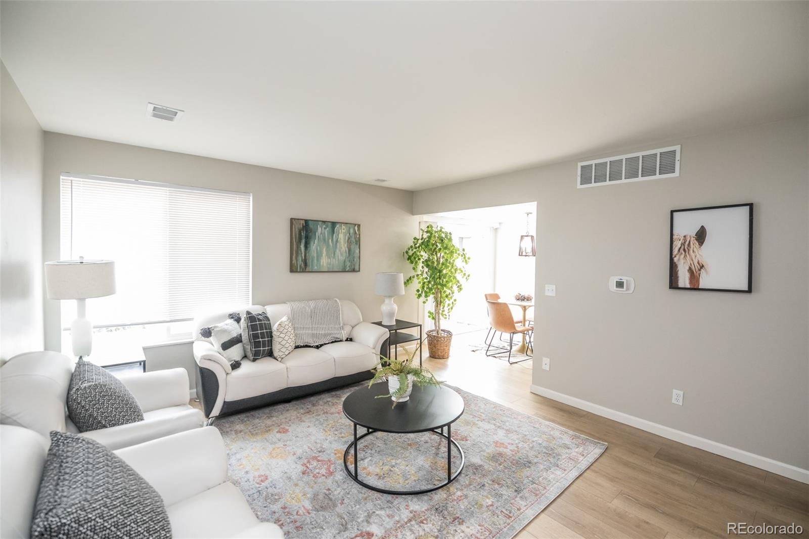 7906 Chase Circle, Unit 143 Arvada, CO 80003 - Photo 3 of 38 a living room with furniture and a large window