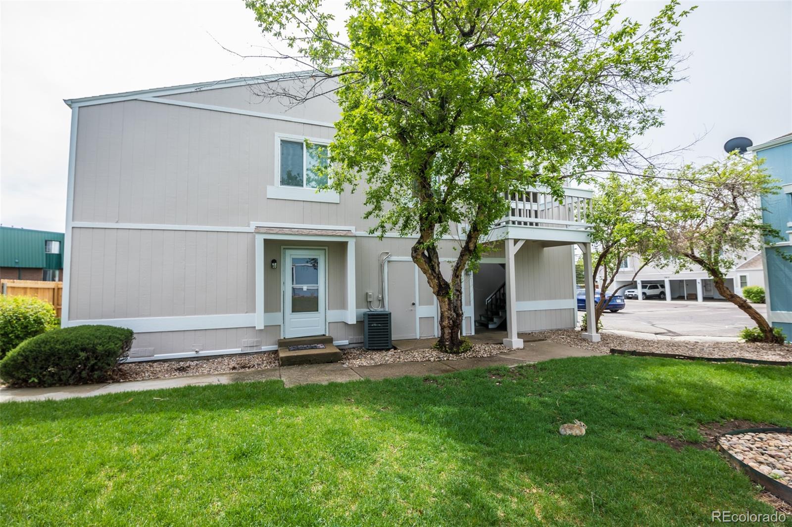 7906 Chase Circle, Unit 143 Arvada, CO 80003 - Photo 34 of 38 a view of a house with backyard and a tree