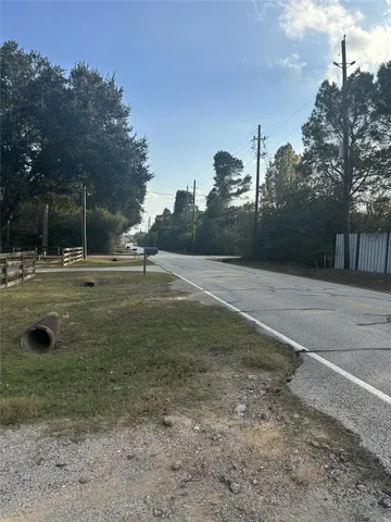 a view of outdoor space with playground and green space