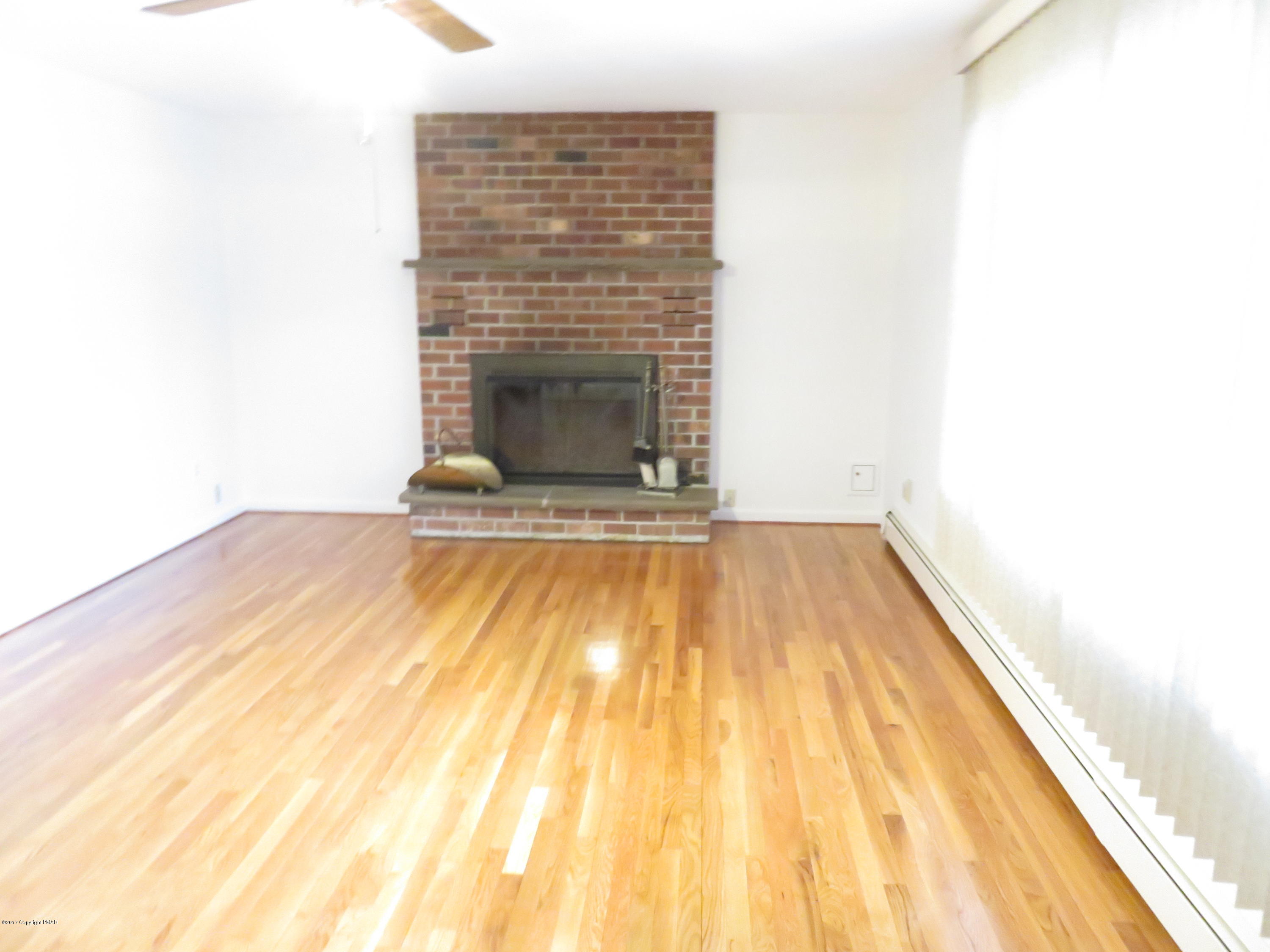 168 Turkey Ridge Kunkletown, PA 18058 - Photo 4 of 33 a view of a room with wooden floor and a fireplace