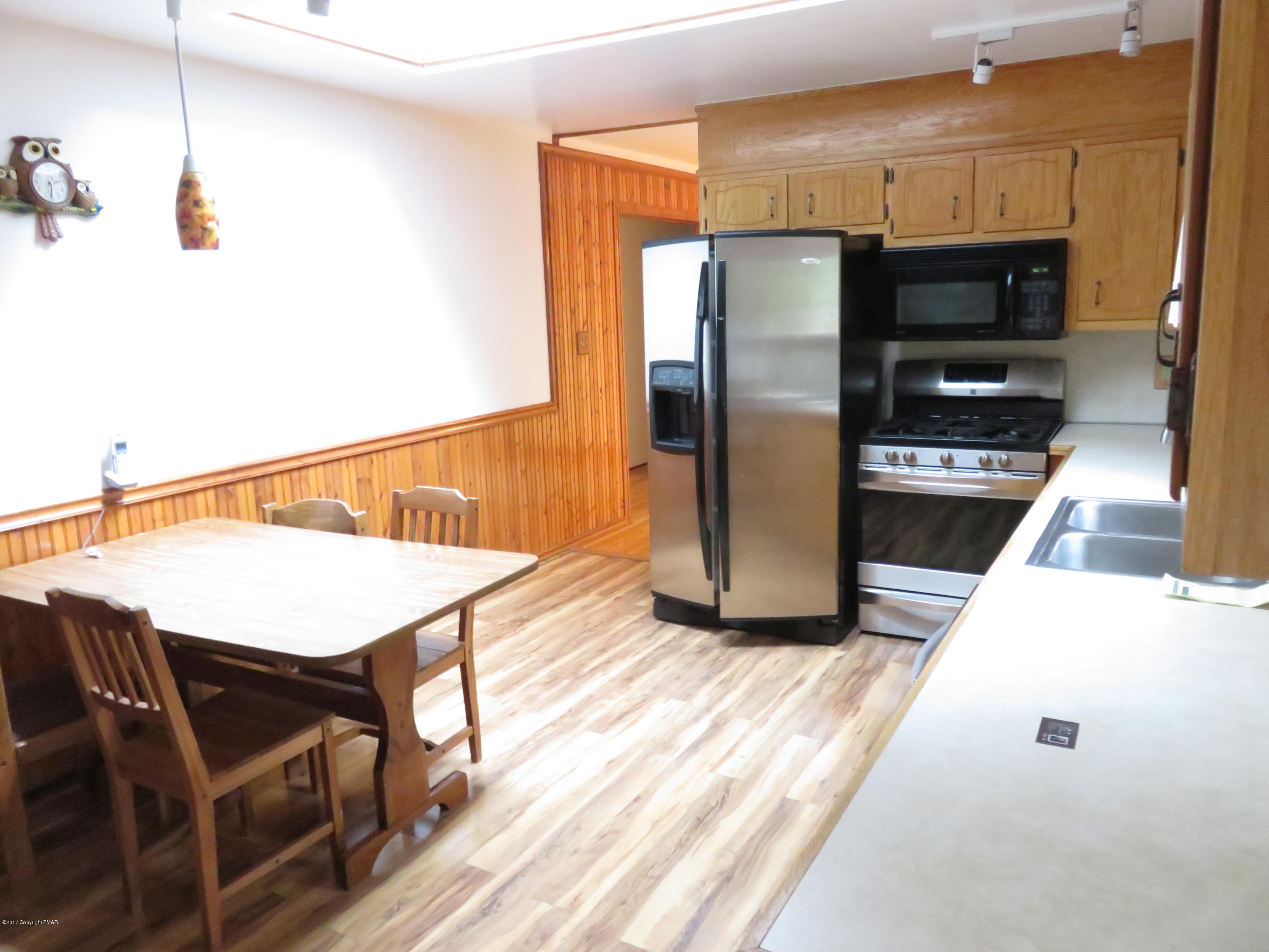 168 Turkey Ridge Kunkletown, PA 18058 - Photo 7 of 33 a kitchen with stainless steel appliances a stove a refrigerator and a microwave