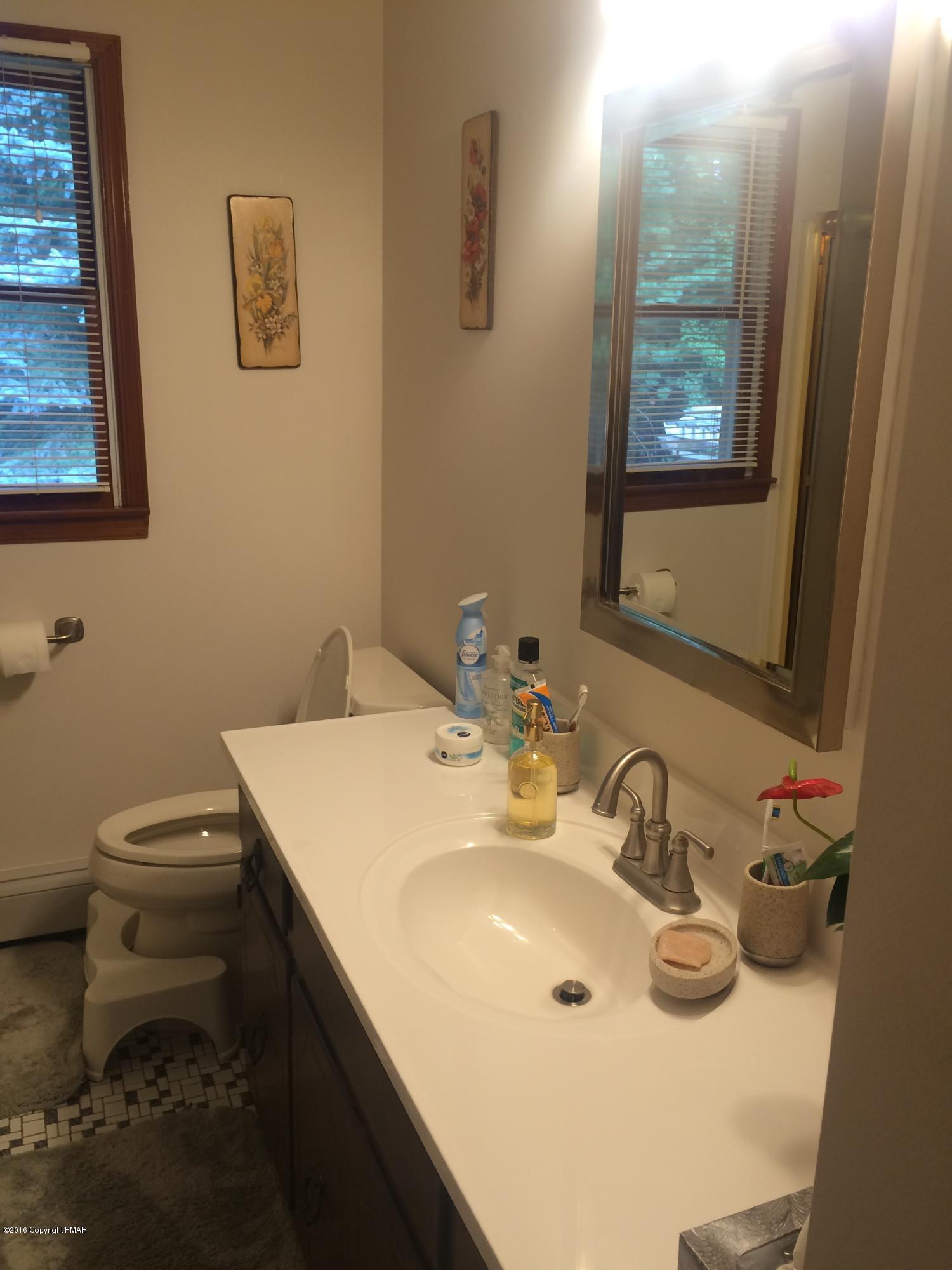 168 Turkey Ridge Kunkletown, PA 18058 - Photo 10 of 33 a bathroom with a sink toilet and mirror