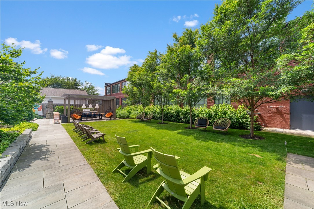 2048 Fulton Road, Unit 107 Cleveland, OH 44113 - Photo 15 of 37 Lawn with adirondack chairs in community courtyard