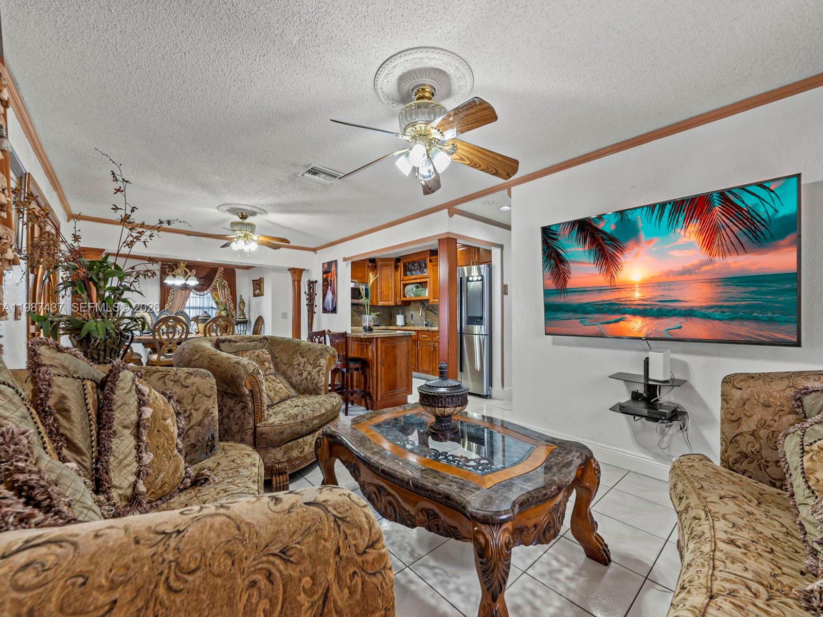 871 Southeast 5th Place Hialeah, FL 33010 - Photo 14 of 39 a living room with furniture a flat screen tv and a large window