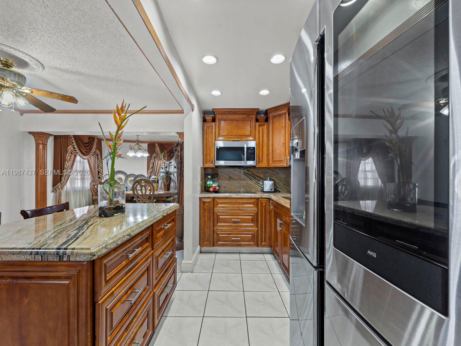 871 Southeast 5th Place Hialeah, FL 33010 - Photo 16 of 39 a kitchen with stainless steel appliances granite countertop counter top space and cabinets