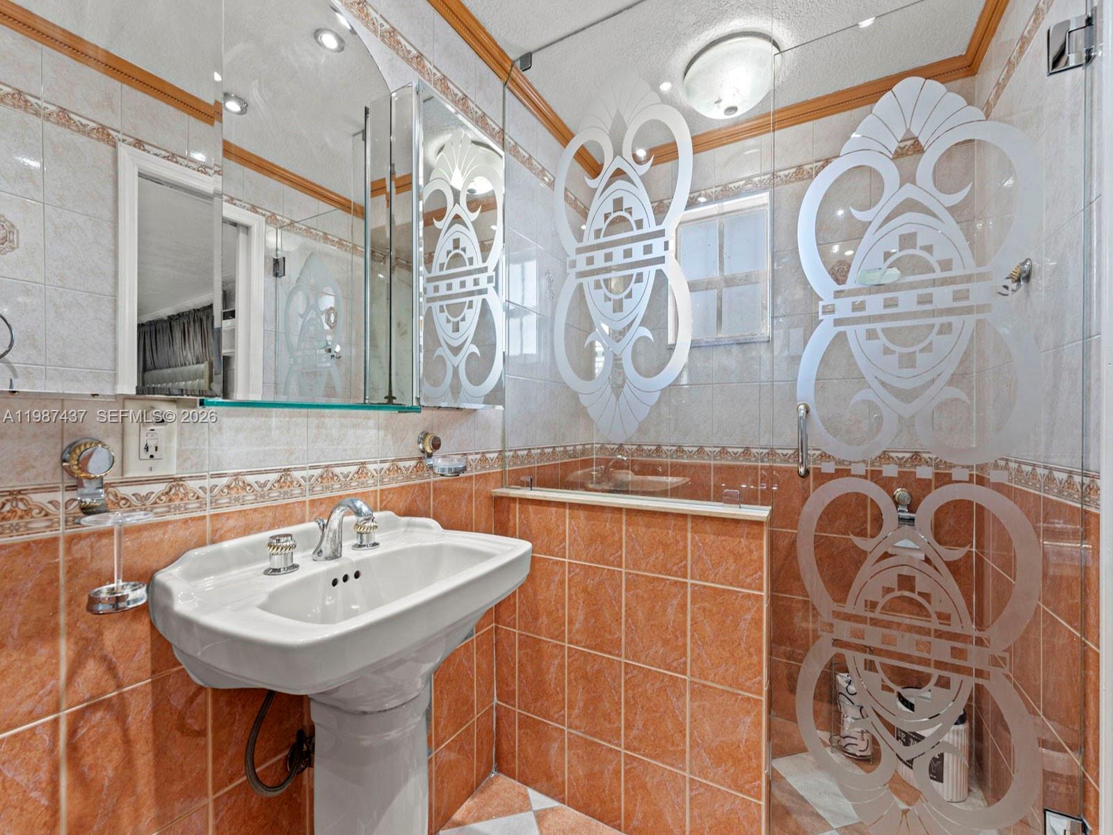 871 Southeast 5th Place Hialeah, FL 33010 - Photo 21 of 39 a bathroom with a sink and a mirror