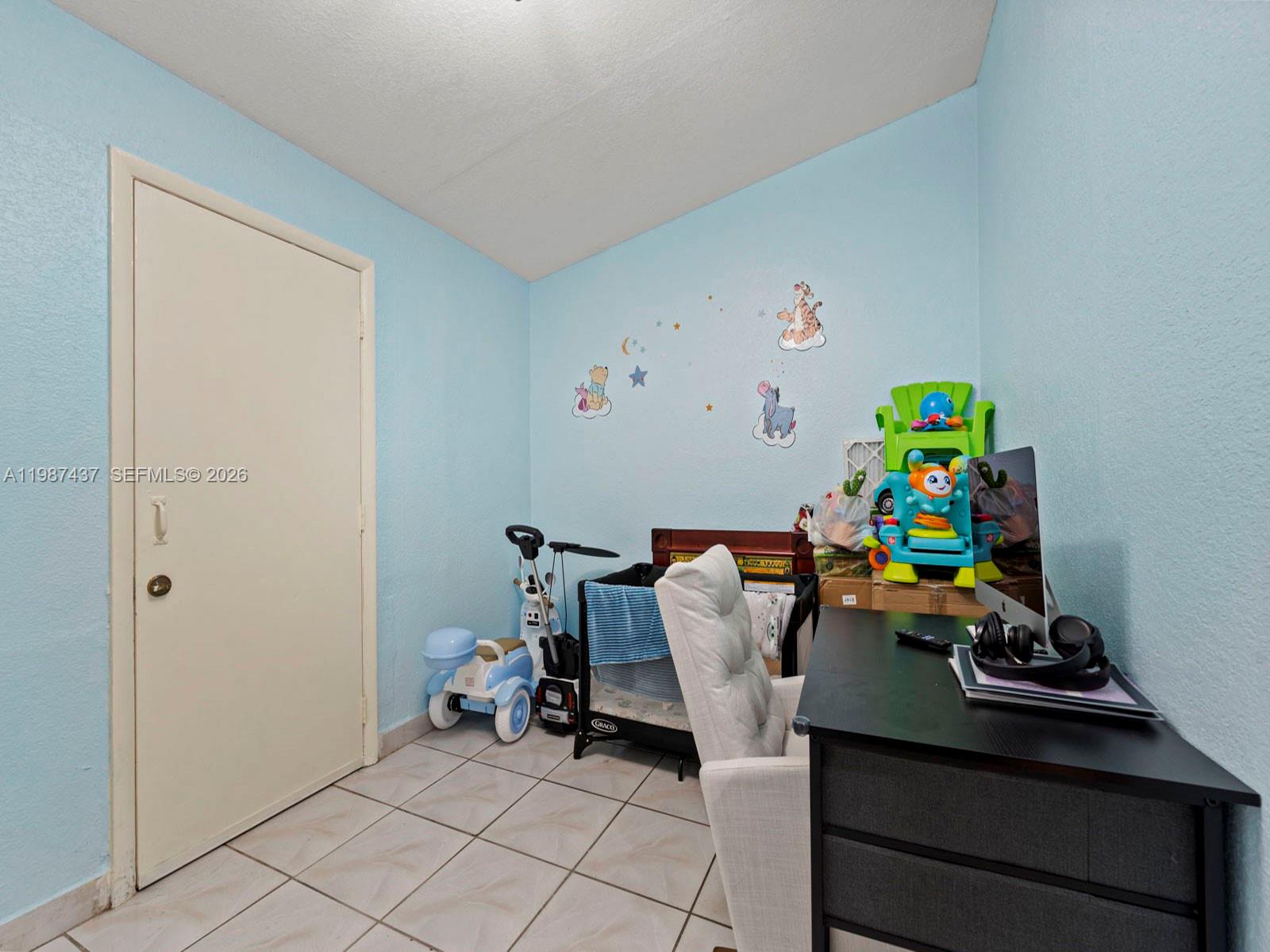 871 Southeast 5th Place Hialeah, FL 33010 - Photo 24 of 39 a view of a workspace with furniture and toys